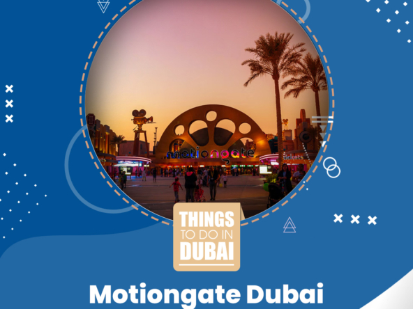 Twilight scene at the entrance of Motiongate Dubai with visitors and palm trees under a purple sky.