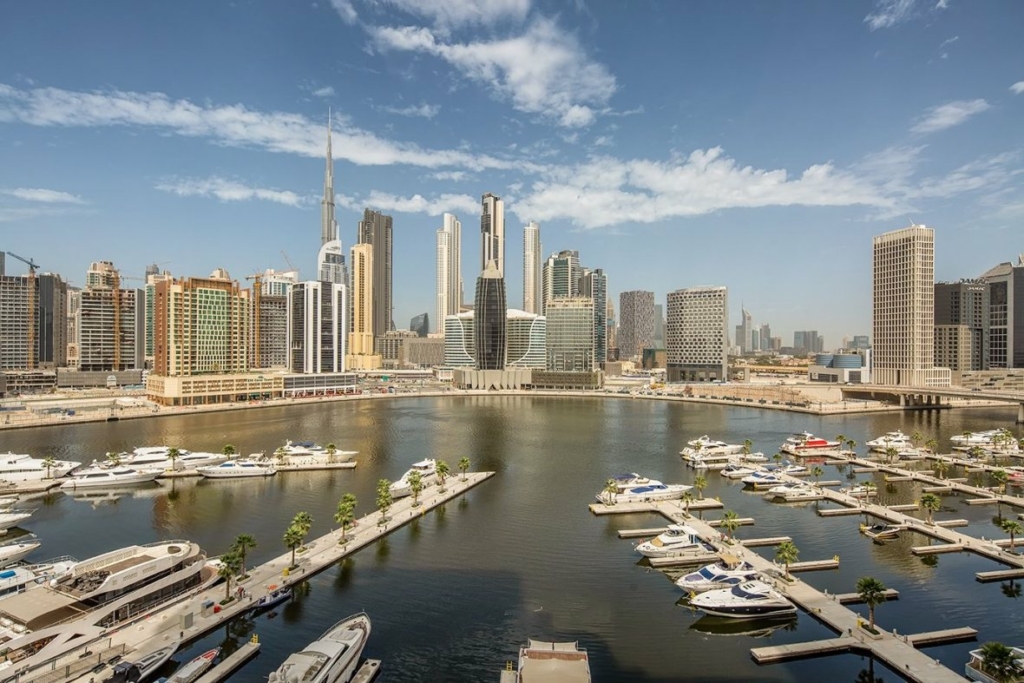 Modern office building in Business Bay, Dubai, with a sleek glass facade.