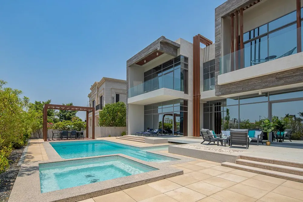 A modern, luxurious villa in Dubai Hills Estate with a private pool and panoramic views of lush greenery.