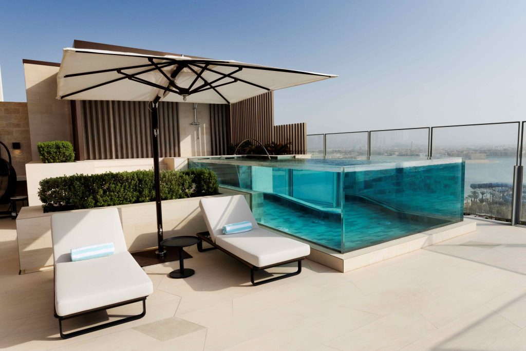 A stunning private pool in a luxurious Dubai apartment with city skyline views.